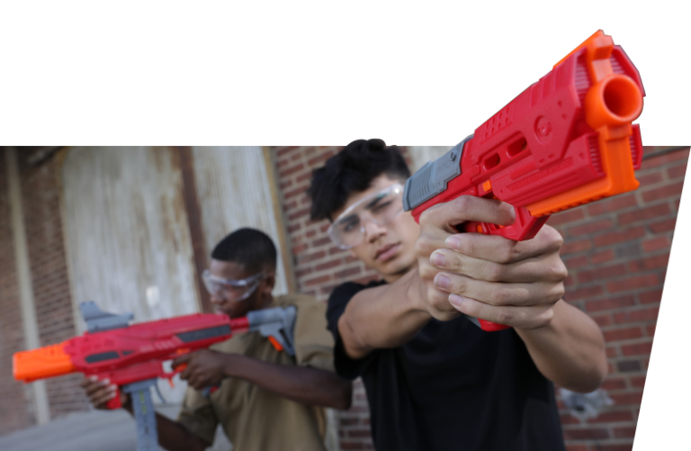 Two people aiming blasters.